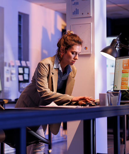 businesswoman-analyzing-financial-growth-report-computer 1