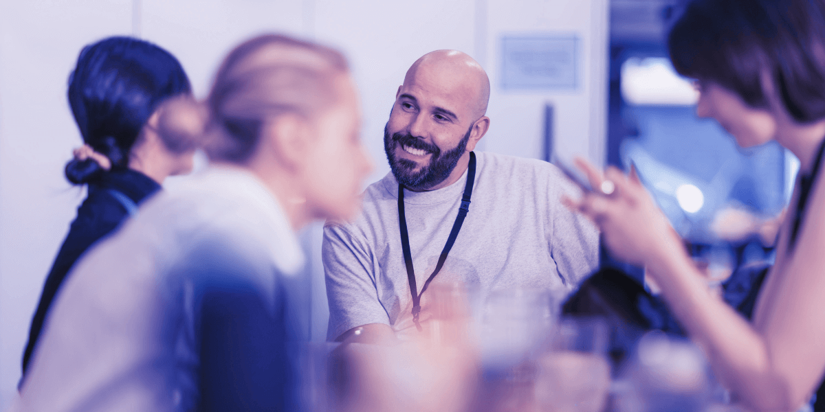 Group of professionals in discussion around a table, symbolizing IT consulting and strategic planning for CPA firms.